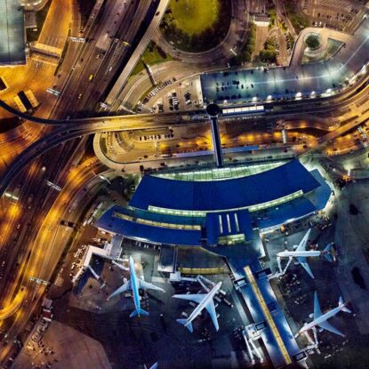 An aerial photograph of JFK airport at night.