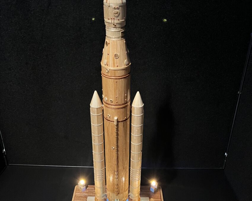 A sculpture of the Artemis SLS Rocket made of matchsticks, wood stirrers and toothpicks.